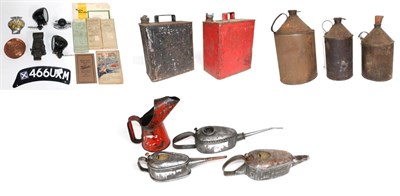 Lot 1027 - A Red Painted Fuel Can; a black painted Shell Motor Spirit fuel can; three rusted cylindrical...