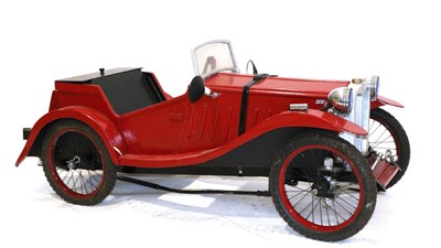 Lot 1028 - A Red Painted Pedal Car, modelled after a 1930s MG sports car, with chromed head lamps, wire wheels