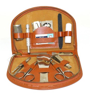 Lot 1058 - Riley Interest: A 1950s Light Brown Leather Zip Operated Travelling Case, fitted with scissors,...