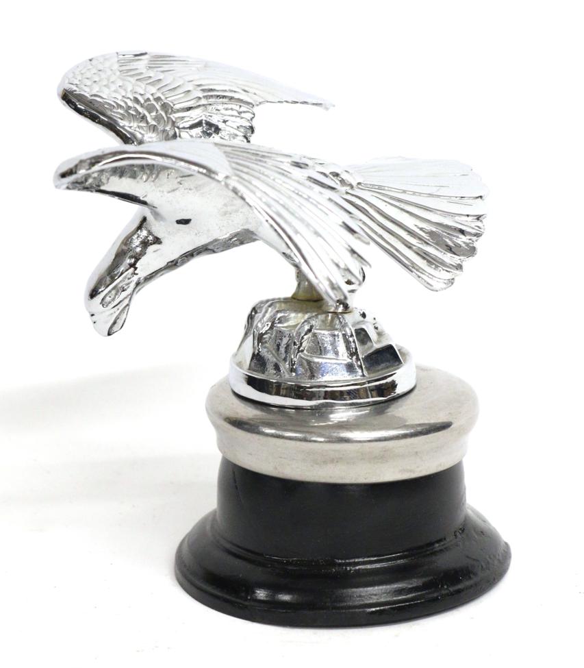 Lot 1087 - A 1933 Alvis Eagle Car Mascot, with outstretched wings standing on a rocky base mounted on a...