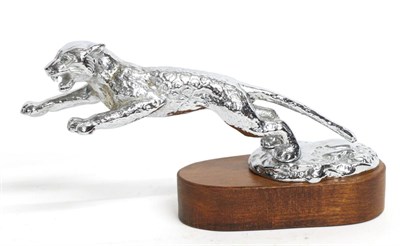 Lot 1094 - A Chrome Car Mascot in the form of a Jaguar, outstretched, on a circular base and mounted on an...