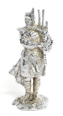 Lot 1102 - A Chrome Plated on Brass Car Mascot in the form of a Scots Piper, 15.5cm high  Buyer's premium...