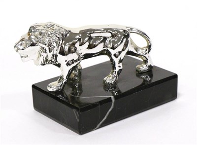 Lot 1108 - A Peugeot Chrome Car Mascot Modelled as a Lion, mounted on a black and white veined marble...