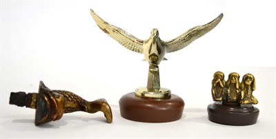 Lot 1117 - Three Brass Car Mascots, comprising an Edwardian mascot in the form of a stylised dolphin, 10cm...