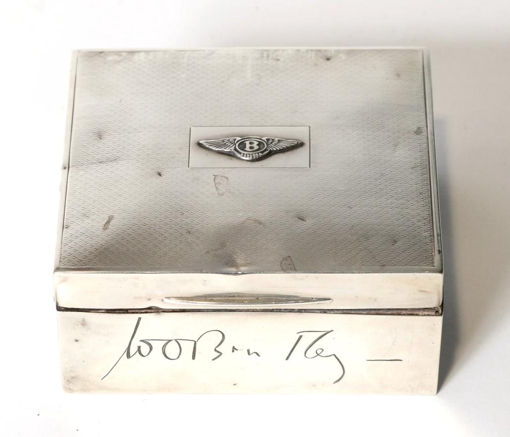 Lot 4 - A 1920s Silver Cigarette Box, London hallmarks worn, the hinged lid with engine turned...