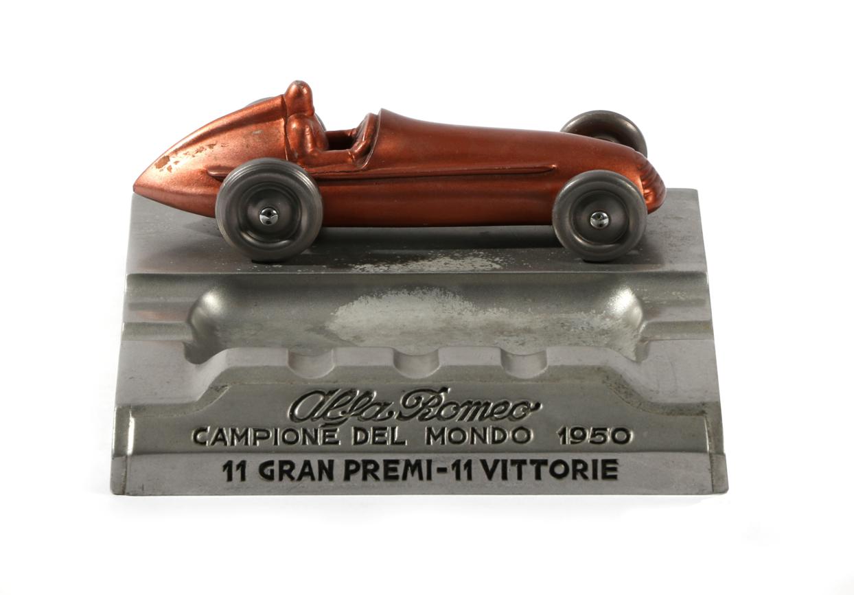 Lot 8 - A Rare 1950 Alfa Romeo Cast Metal Ashtray, of moulded form and surmounted with a model of an...
