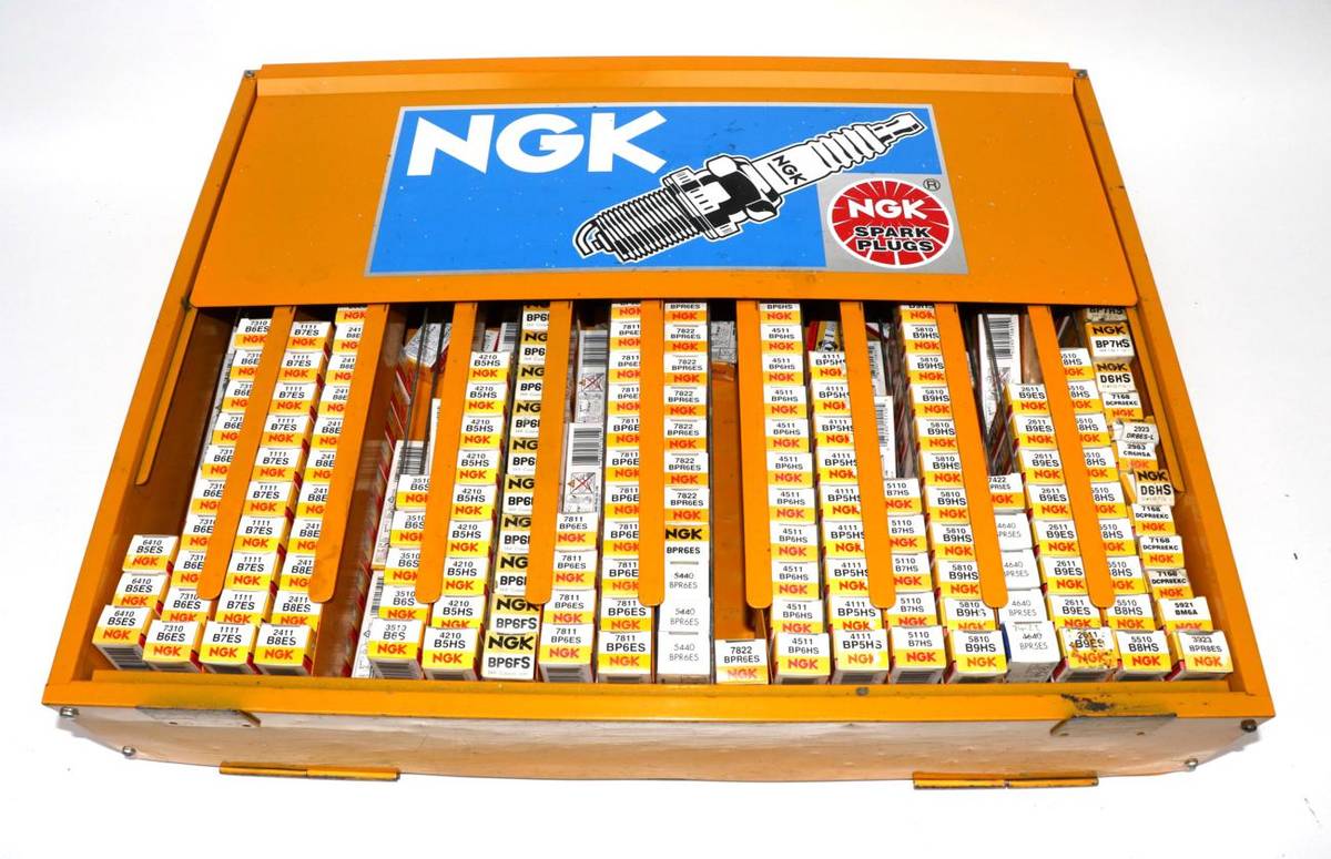 Lot 71 - An NGK Yellow Painted Metal Spark Plug Cabinet, containing approximately 190 assorted spark plugs