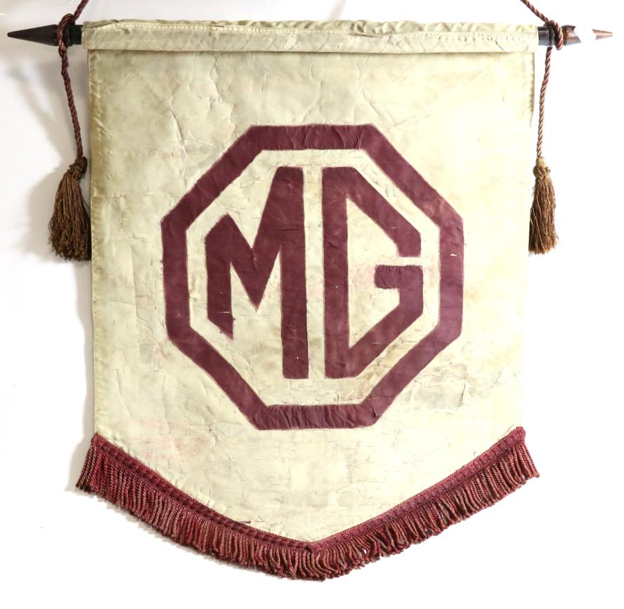 Lot 87 - A Vintage MG Pennant Flag on Fabric, of shield shaped form with tasselled edge, suspended on a...
