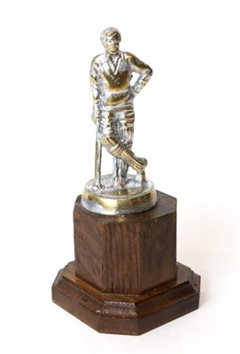 Lot 139 - A Plated Brass Vintage ";Cricketer"; Accessory Mascot, 12cm high, mounted on a wooden display base