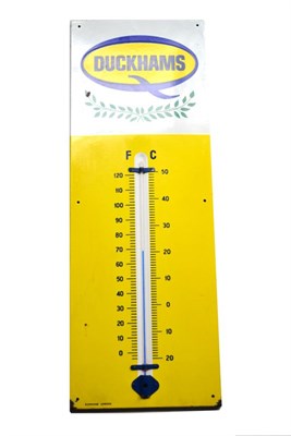 Lot 216 - A Duckhams Single-Sided Enamel Advertising Sign, painted yellow, with a mercury thermometer for...