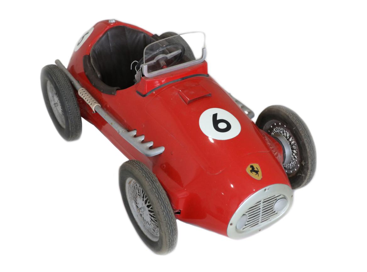 Lot 261 - A Child's Vintage Ferrari Pedal Car, by Giordani, painted red and numbered 6, with brown...