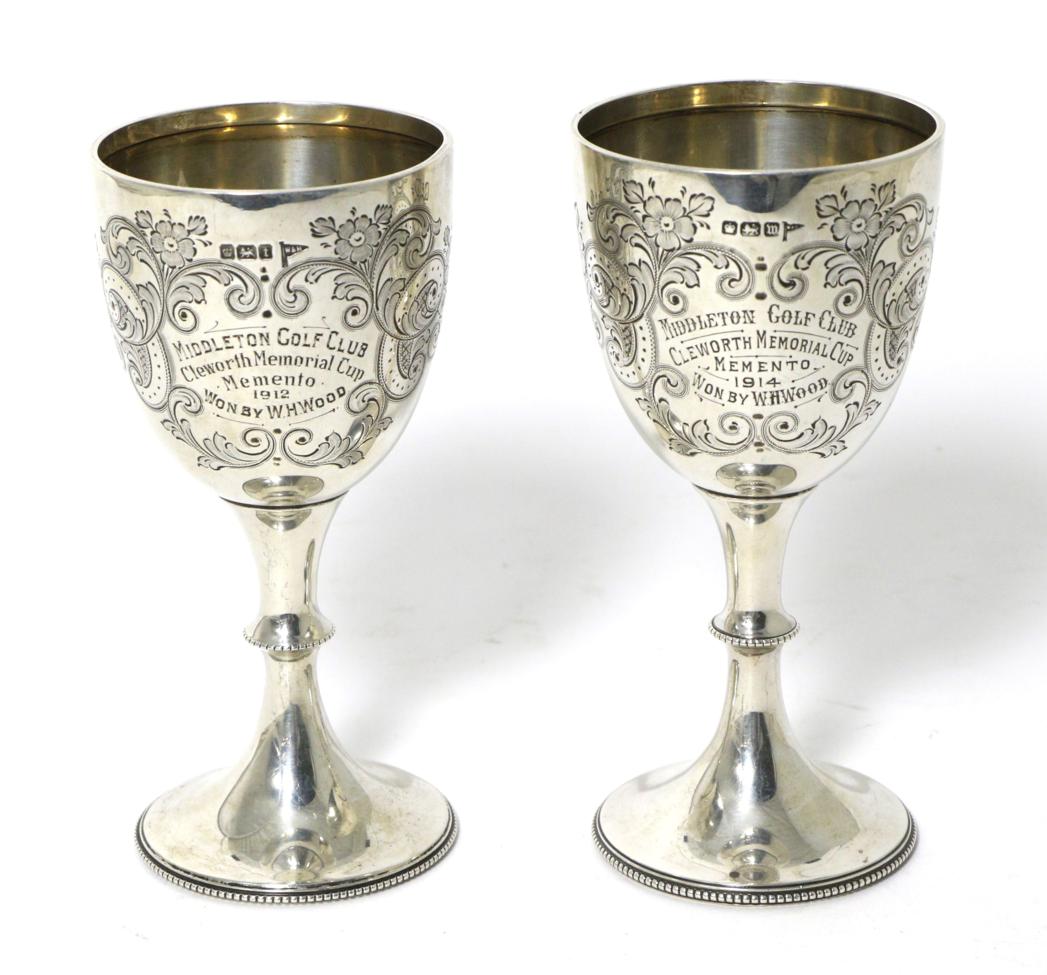 Lot 3 - A Near Pair of George V Silver Presentation Goblets, Walker & Hall, Sheffield 1911/14, with...