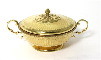 Lot 65 - A Silver Gilt Twin Handled Porringer and Cover, S Blanckensee & Son, Chester 1936, fluted and...