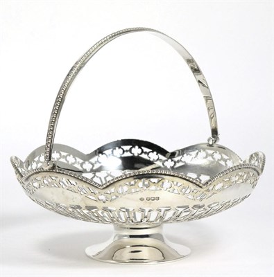 Lot 73 - A George V Silver Swing Handled Basket, William Hutton & Sons, Sheffield 1918, circular with shaped
