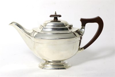 Lot 87 - An Art Deco Silver Teapot, John & William F Deakin, Sheffield 1926, shaped oval on pedestal...