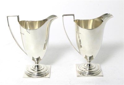 Lot 90 - A Pair of George III Style Silver Cream Jugs, James Dixon & Son, Sheffield 1972, plain pedestal...