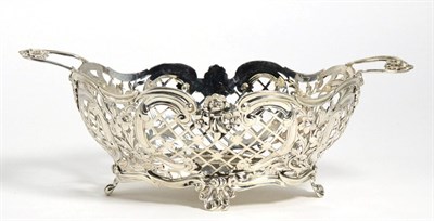 Lot 109 - A Victorian Pierced Silver Basket, Susannah Brasted, London 1889, oval with twin handles, the sides