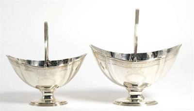 Lot 111 - A Graduated Pair of George III Silver Swing Handled Sugar Baskets, John Harris III, London...