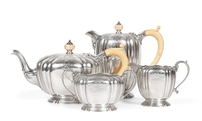 Lot 122 - A Silver Four Piece Tea Service, Adie Brothers, London 1938, circular with fluted sides and...