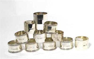 Lot 178 - A Group of Twelve Silver Napkin Rings, various dates and makers, comprising: a near set of six with