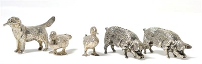 Lot 192 - A Group of Silver Models of Animals, comprising: two pigs, Sheffield 2009; a dog, with a stick...