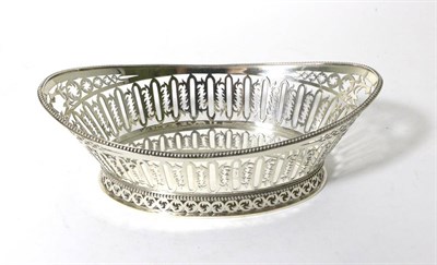 Lot 214 - A Late Victorian Pierced Silver Bread Basket, William Comyns, London 1897, oval with bead...