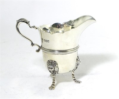 Lot 284 - A Late Victorian Silver Cream Jug, Goldsmiths & Silversmiths, London 1900, helmet shape with ribbed