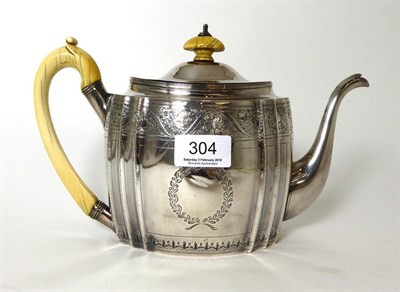 Lot 304 - A George III silver teapot, Samuel Godbehere & Edward Wigan, London 1798, shaped oval with engraved