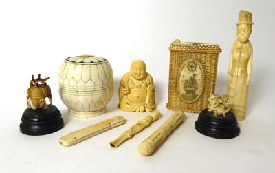 Lot 319 - A small collection of ivory and bone including boxes, figures, needle case etc