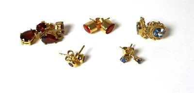Lot 323 - Five pairs of 9 carat gold gem set earrings comprising of ruby, sapphire, fire opal, garnet and...