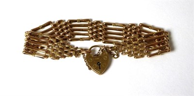 Lot 328 - A gate link bracelet with engraved padlock clasp, padlock stamped '9' '.375'