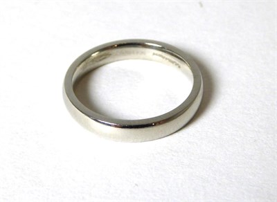 Lot 330 - A platinum band ring, finger size J