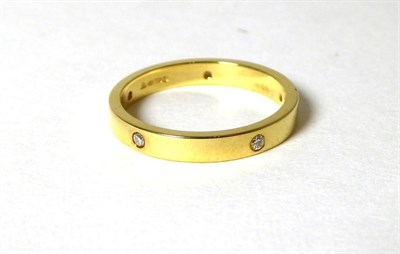 Lot 334 - An 18 carat gold diamond set band ring, total estimated diamond weight 0.10 carat...