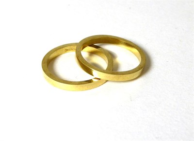 Lot 337 - Two 18 carat gold band rings, finger sizes N and N (2)