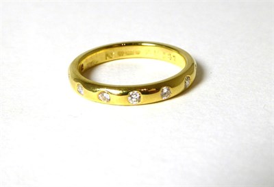 Lot 343 - An 18 carat gold diamond set band ring, total estimated diamond weight 0.25 carat...