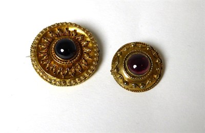 Lot 347 - A Victorian garnet target brooch, a round cabochon garnet in a rubbed over setting within a...
