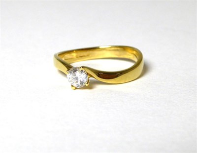 Lot 357 - An 18 carat gold solitaire diamond ring, a round brilliant cut diamond in a claw setting, to bypass
