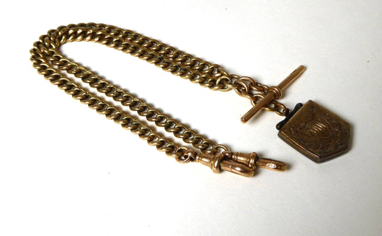 Lot 366 - A 9 carat gold Albert with a t-bar and clips, suspending a locket, length 40cm