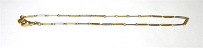 Lot 370 - A two colour long link Albert, with clip and spring ring, as a necklace, length 36cm, clip...