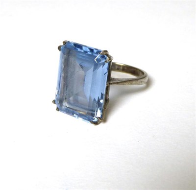 Lot 374 - A 9 carat white gold blue topaz ring, an octagonal cut blue topaz in a double claw setting, to...