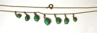 Lot 383 - An amazonite and seed pearl fringe necklace, seven graduated amazonite drops in cage settings,...