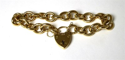 Lot 386 - A 9 carat gold curb link bracelet, with a 9 carat gold heart shaped padlock clasp, length 23cm...
