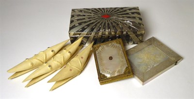 Lot 388 - A Cantonese mother-of-pearl card case, circa 1860, carved with exotic birds in branches and...