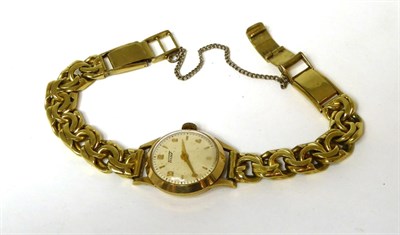 Lot 398 - A lady's 14k gold wristwatch, signed Tissot, with attached bracelet with clasp stamped 0.750