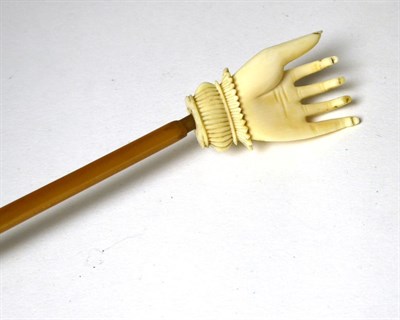 Lot 403 - A late Victorian rhino horn and carved ivory back scratcher