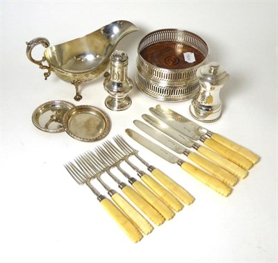 Lot 422 - A group of silver items comprising a George III style sauceboat; a pair of pierced modern wine...