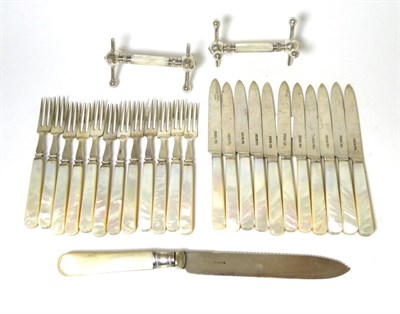 Lot 424 - Silver and mother of pearl fruit knives and forks, twelve forks and eleven knives; a silver...