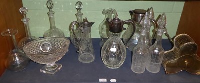 Lot 431 - Two silver plated mounted glass claret jugs; a similar lemonade jug; a three bottle decanter stand