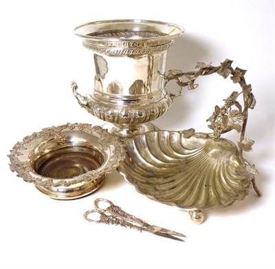 Lot 441 - A silver plated twin handled wine cooler; a wine coaster with fruiting vine rim and a grape...