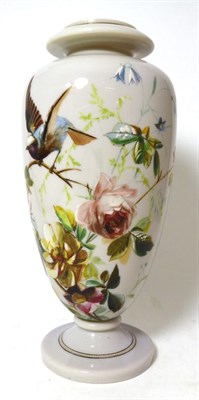 Lot 474 - A Continental opaque glass vase painted with a garden bird perched on a branch amongst flowers,...